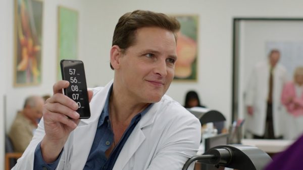 Peter Facinelli holding a phone in Countdown