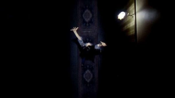 An overhead shot of Linda (Jacki Kerin) running down a hallway
