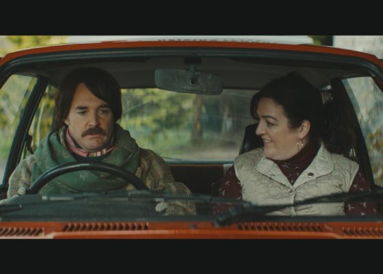 Will Forte and Maeve Higgins sit in a car