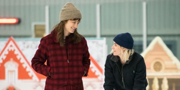 Mackenzie Davis as Harper looks down at Kristen Stewart as Abby, bent over trying to skate