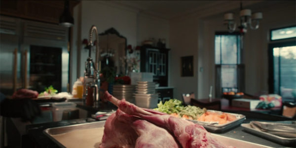 A large piece of uncooked goat on a counter top