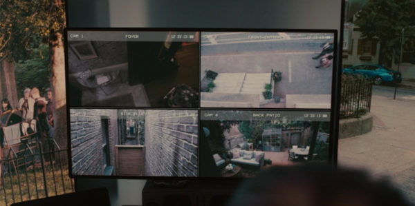 A computer screen displaying 4 rooms of surveillance footage