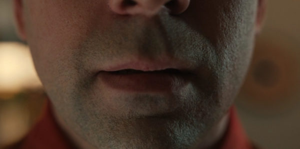 An extreme close-up of a man's lips