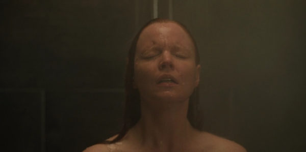 A medium shot of woman in the shower