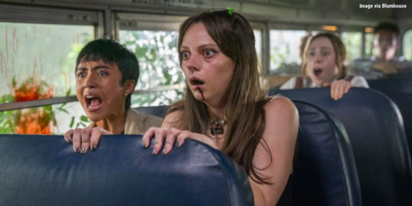 A group of shocked, bloodied teens on a bus