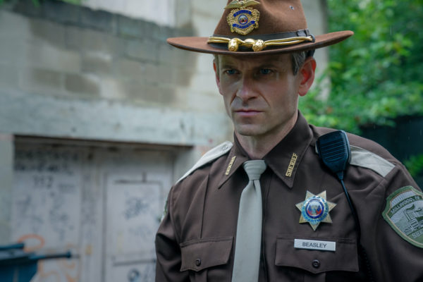 A man in a sheriff's uniform
