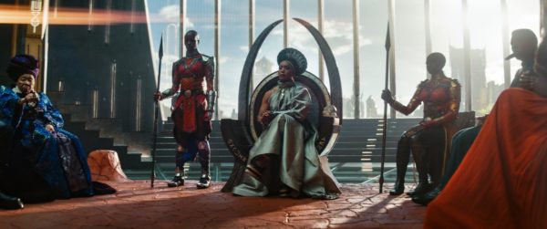 A group of Wakandas sit around a throne