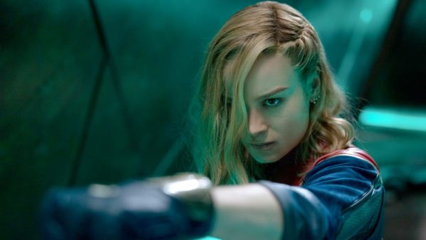 Brie Larson as Captain Marvel, pointing her wrist towards the camera