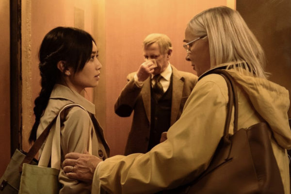 Penelope (Lisa Paxton - R) grabs the arm of Cassandra (Gabrielle Jacinto - L) in front of an open elevator