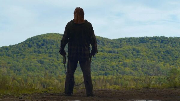 Johnny (Ry Barrett) stands at the edge of a cliff