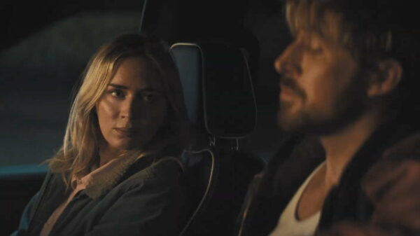 Jody (Emily Blunt) sits in the passenger seat next to Colt (Ryan Gosling) in the driver's seat