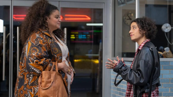 Dawn (Michelle Buteau) and Eden (Ilana Glazer) stand in front of a movie theatre