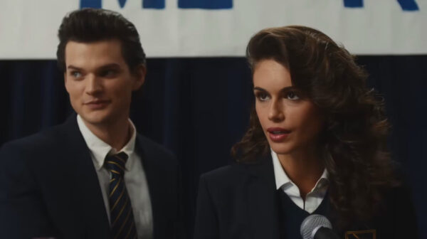 Two dark haired teenagers - a boy (l) and a girl with curly long hair (R)