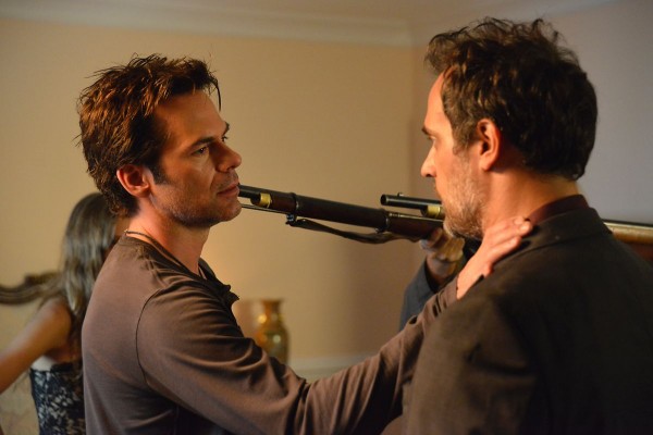 In every episode of Revolution, including 1x06, Miles (Billy Burke) MUST have a weapon pointed at his head. It is a contractual obligation