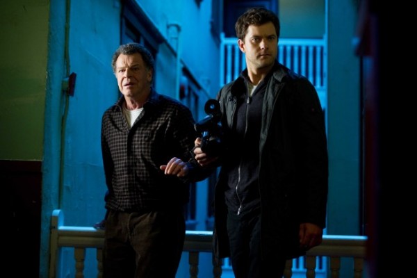 Paranormal Activity: Walter (John Noble) and Peter (Joshua Jackson) prepare to video in 'Through The Looking Glass And What Walter Found There'
