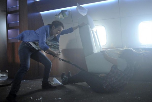 Simmons (Elizabeth Henstridge) suffers through mid-air turbulence protecting the 0-8-4 in Marvel's Agents of S.H.I.E.L.D's second episode