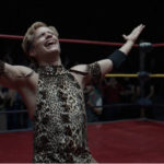 Gael Garcia Bernal as wrestler Cassandro, wearing a snakeskin wrestling outfit and blonde hair